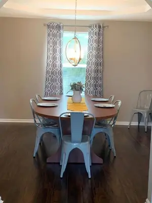 a dining room with a table and chairs and a window at 4 Bed 2.5 Bath Sleeps 10- King of Karincrest in Middletown