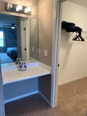 a dressing room with a mirror on a wall at 4 Bed 2.5 Bath Sleeps 10- King of Karincrest in Middletown