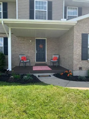 two chairs on a patio in front of a house at 4 Bed 2.5 Bath Sleeps 10- King of Karincrest in Middletown