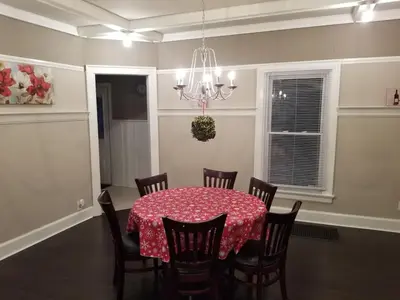 a dining room with a table with chairs and a chandelier at Middletown Centenarian 4 Bed 2 Bath Sleeps 12 in Middletown