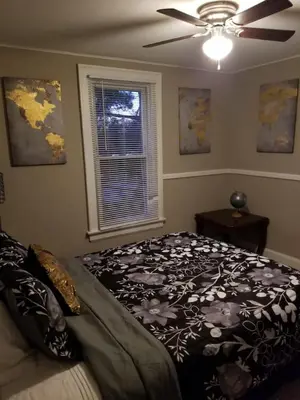 a bedroom with a bed and a ceiling fan at Middletown Centenarian 4 Bed 2 Bath Sleeps 12 in Middletown