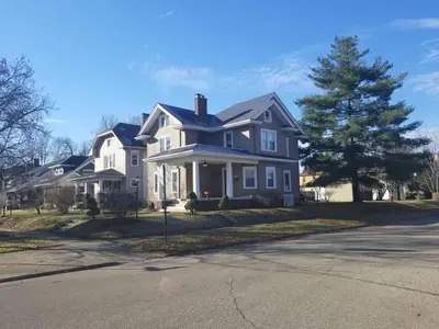 a large white house on a street at Middletown Centenarian 4 Bed 2 Bath Sleeps 12 in Middletown