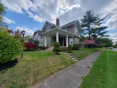 a white house with a pathway in front of it at Middletown Centenarian 4 Bed 2 Bath Sleeps 12 in Middletown