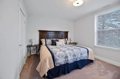 a bedroom with a bed and a window at Main Street Oasis Pool and Hot Tub Sleeps 8 in Hamilton