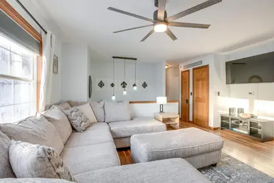a living room with a couch and a ceiling fan at Hocking Hills Hideaway Near Lake Logan in Logan