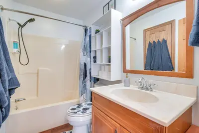 a bathroom with a sink and a tub and a toilet at Hocking Hills Hideaway Near Lake Logan in Logan