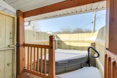 a porch with a bed and a fence at 4 Mi to Lake Logan Hocking Hills Apartment in Logan