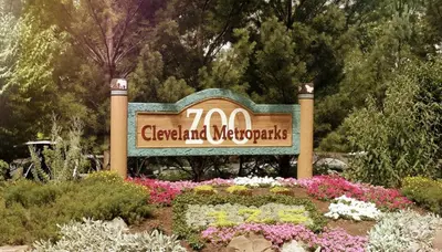 a sign for a garden with flowers and plants at Penthouse Lofts on E 4th, Private Rooftop Patio in Cleveland