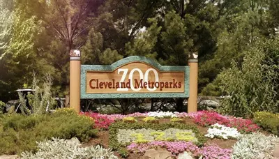 a sign for a garden with flowers and plants at Lofts on E 4th, WALK TO CAVS, Sleeps 6 in Cleveland