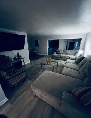 a living room with a couch and a table at Luxury Urban Oasis!15 Min From Downtown Cleveland in Cleveland