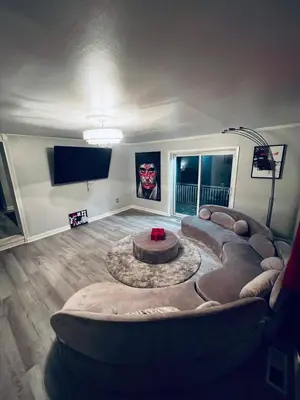a living room with a couch and a table at Luxury Urban Oasis!15 Min From Downtown Cleveland in Cleveland