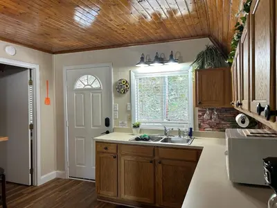 a kitchen with a sink and a window at Cherokee Cabin-Cave Run Lake and Cliff Views-Red River Gorge in Big Woods