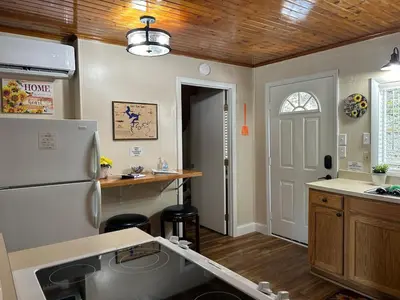a kitchen with a refrigerator and a counter top at Cherokee Cabin-Cave Run Lake and Cliff Views-Red River Gorge in Big Woods