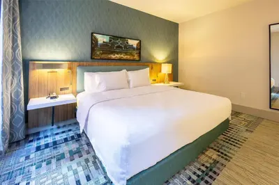 a large white bed in a hotel room at Hilton Garden Inn Dayton Downtown in Dayton