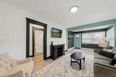a living room with a couch and a table at Welcome to the Treasure house! in Westlake