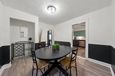 a dining room and living room with a table and chairs at Welcome to the Treasure house! in Westlake