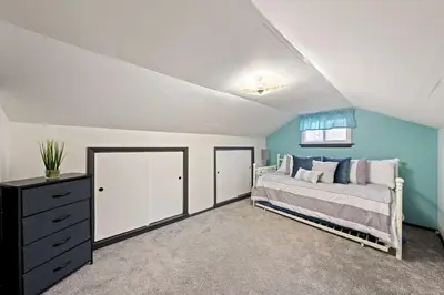 a bedroom with a bed and a dresser at Welcome to the Treasure house! in Westlake