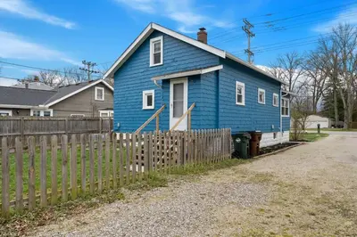 a blue house with a fence in front of it at Welcome to the Treasure house! in Westlake