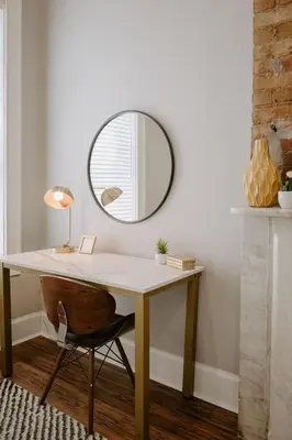 a desk with a mirror and a chair at Stunning 4BR Townhome Rooftop City Views in Cincinnati