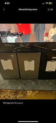 two boxes with stickers on them in front of a tv at Tarawa drive in Cincinnati