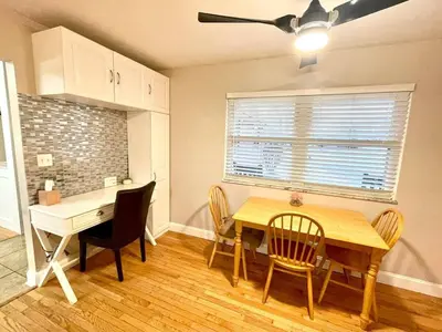 a kitchen and dining room with a table and chairs at Large Private Ranch - Master Bedroom Suite with King Bed and private Bathroom - Fenced Yard - Pets & Kids Welcome - Pool Table in Columbus