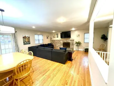 a living room with a couch and a table at Large Private Ranch - Master Bedroom Suite with King Bed and private Bathroom - Fenced Yard - Pets & Kids Welcome - Pool Table in Columbus