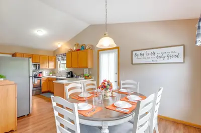 a kitchen with a table and chairs in a kitchen at 17 Mi to Columbus Pickerington Home with Fire Pit! in Pickerington