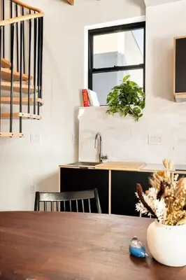 a kitchen and dining room with a table and a sink at Luxury Loft near Washington Park - Rooftop Deck in Cincinnati