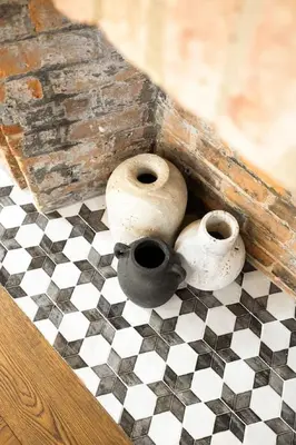 two vases sitting on top of a checkered floor at Luxury Loft near Washington Park - Rooftop Deck in Cincinnati