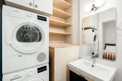 a laundry room with a washing machine and a sink at Walk to ALL - Washington Park - FREE Streetcar in Cincinnati