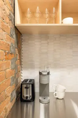 a kitchen counter with a toaster and a coffee maker at Walk to ALL - Washington Park - Gorgeous 2BR Condo in Cincinnati