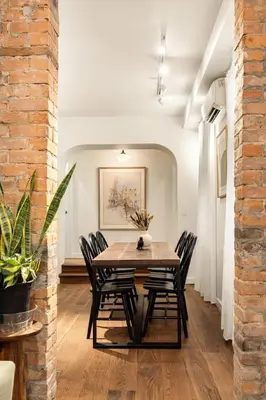 a dining room with a table and chairs at Walk to ALL - Washington Park - Gorgeous 2BR Condo in Cincinnati