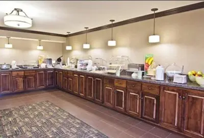 a large kitchen with wooden cabinets and a counter at Quality Inn Chillicothe in Chillicothe