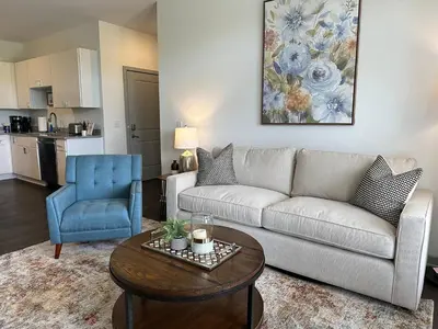 a living room with a couch and a table at The Dublin Designer 1st Floor Available Now in Dublin