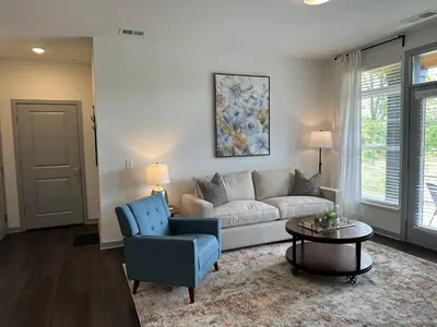 a living room with a couch and a table at The Dublin Designer 1st Floor Available Now in Dublin