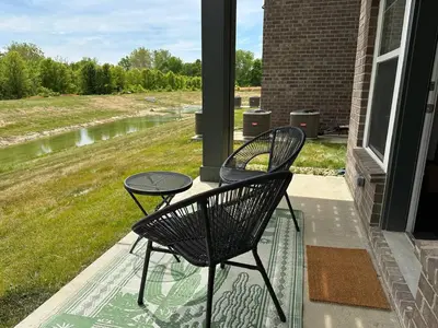 two chairs and a table on a porch at The Dublin Designer 1st Floor Available Now in Dublin