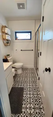 a bathroom with a toilet and a sink at Wildwood Retreat in Dalton