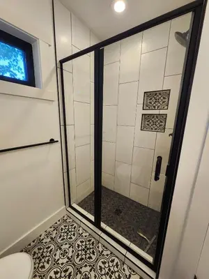 a shower in a bathroom with a toilet at Wildwood Retreat in Dalton
