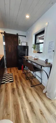 a room with a desk and a table and a window at Wildwood Retreat in Dalton