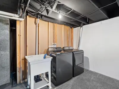 a garage with a stove and a counter in it at Vermilion Retreat with Game Room, Hot Tub and Across from Community Pool in Vermilion