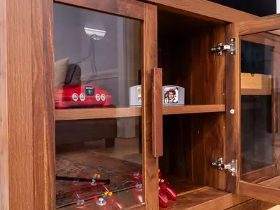 a glass door of a cabinet with a red toy car in it at 4 Bed 2 Bath Walk to Lakewood Restaurants and Shops in Lakewood