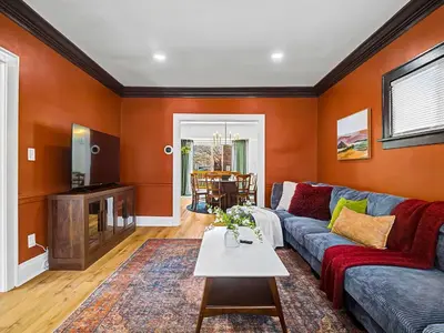 a living room with a couch and a table at 4 Bed 2 Bath Walk to Lakewood Restaurants and Shops in Lakewood