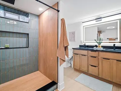 a bathroom with a shower and a sink at Luxurious Retreat with Sauna and Modern Design in Warrensville Heights