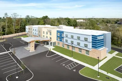 a rendering of a building with a parking lot at Fairfield by Marriott Inn & Suites Oxford in Oxford