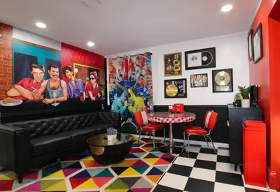 a living room with a couch and a table at Rock N Roll, Mins to CP & SF, King, Pet OK in Sandusky