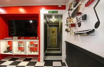 a hallway with a yellow door and a red wall at Rock N Roll, Mins to CP & SF, King, Pet OK in Sandusky