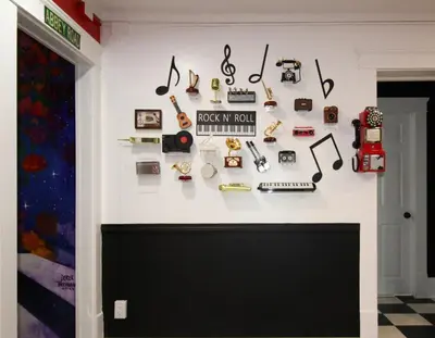 a wall with a bunch of objects on it at Rock N Roll, Mins to CP & SF, King, Pet OK in Sandusky