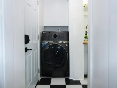 a washer and dryer in a white room at Rock N Roll, Mins to CP & SF, King, Pet OK in Sandusky