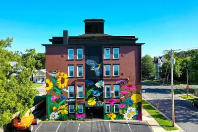 a building with a painting of flowers on it at Rock N Roll, Mins to CP & SF, King, Pet OK in Sandusky
