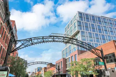 a metal arch over a street in a city at The Nook on Neil Walkable 3BR in Columbus